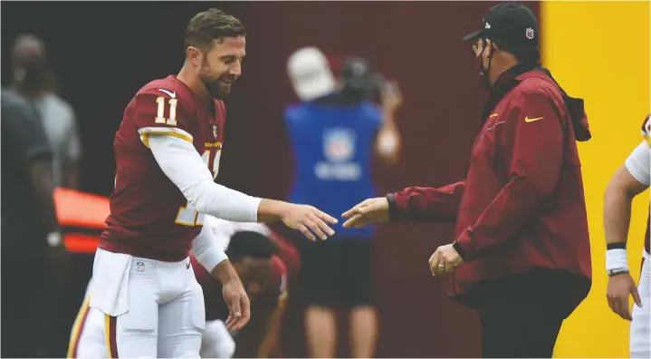 ?? — GETTY IMAGES ?? By removing Alex Smith, Washington head coach Ron Rivera marks the start of a new era for the team, Les Carpenter says. But he won't be easily replaced.