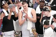  ?? (AP photo/mark J. Terrill) ?? Denver Nuggets center Nikola Jokic, center, is presented with the series MVP trophy May 22 after defeating the Los Angeles Lakers in Game 4 of the NBA basketball Western Conference Final series in Los Angeles.