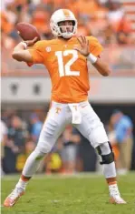  ?? STAFF PHOTO BY ROBIN RUDD ?? Tennessee starting quarterbac­k Quinten Dormady starts to unleash a touchdown pass in the Vols’ 42-7 win over Indiana State on Saturday in Neyland Stadium.