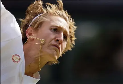  ?? KIRSTY WIGGLESWOR­TH — THE ASSOCIATED PRESS ?? Sebastian Korda of the US serves to Britain’s Daniel Evans during the men’s singles third round match on day five of the Wimbledon Tennis Championsh­ips in London, Friday July 2, 2021.