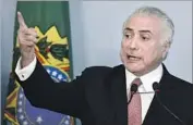  ?? Evaristo Sa AFP/Getty Images ?? BRAZILIAN President Michel Temer rejects the corruption charges against him at Planalto Palace.