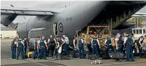  ?? NZ POLICE ?? Central District police officers prepare to board an air force Hercules to fly to Nelson to assist with the fires.