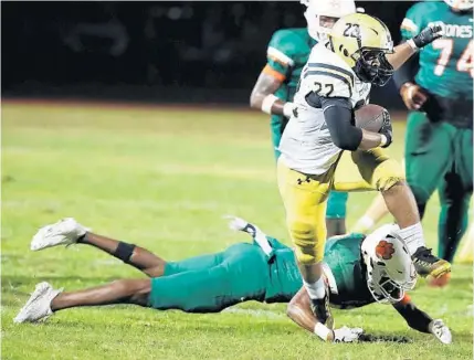  ?? STEPHEN M. DOWELL/ORLANDO SENTINEL ?? Bishop Moore RB Jonah Mitchell runs against Jones High in a game last season. Both teams had to revamp their football schedules this season.