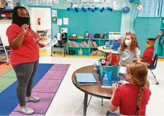  ?? Bill Graham / Associated Press ?? Fourth-grade teacher Krileshia Boyd speaks at Northeast Lauderdale Elementary School in Lauderdale County, Miss. As schools reopen, poor ventilatio­n may force classes outdoors.