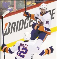  ?? Gene J. Puskar / Associated Press ?? Brock Nelson, right, of the Islanders celebrates his goal with Josh Bailey during the first period Sunday.