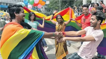  ?? — GETTY IMAGES ?? Members of India’s LGBT community celebrate in Bangalore on Thursday after the Supreme Court struck down a colonial-era ban on gay sex.