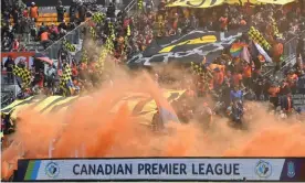  ??  ?? Hamilton Forge fans set off smoke bombs against York 9 in the inaugural game of the Canadian Premier League. Photograph: Canadian Premier League/USA Today Sports