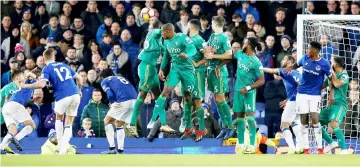  ?? — Reuters photo ?? Everton’s Lucas Digne (third left) scores their second goal from a free kick during the English Premier League match against Watford at Goodison Park in Liverpool, north west England.