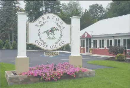  ?? LAUREN HALLIGAN - MEDIANEWS GROUP ?? A “Coming Soon” sign is posted outside of Saratoga Olive Oil Company’s future retail store in Moreau.