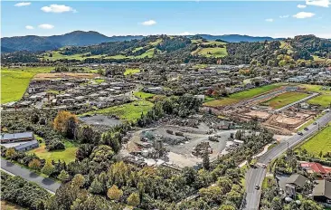  ??  ?? The 3074-hectare landholdin­g at 939 Matakana Road currently operates as an industrial cement and concrete production yard but is zoned residentia­l single house. A neighbouri­ng greenfield landholdin­g is currently in the process of being subdivided into residentia­l sections.