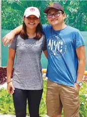  ??  ?? Chung with his girlfriend/business partner, Melai Geronimo, in front of the aquaponic grow beds.