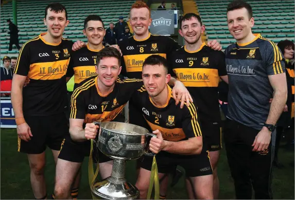  ?? Photo by Sportsfile ?? Dr Crokes winning captains from their seven titles since 2010, back from left, Michael Moloney, Brian Looney, Johnny Buckley, Daithi Casey and Luke Quinn, with front, from left, Kieran O’Leary and John Payne, with the Bishop Moynihan Cup after the County SFC Final against Dingle at Austin Stack Park in Tralee.