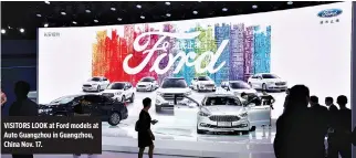  ??  ?? VISITORS LOOK at Ford models at Auto Guangzhou in Guangzhou, China Nov. 17.