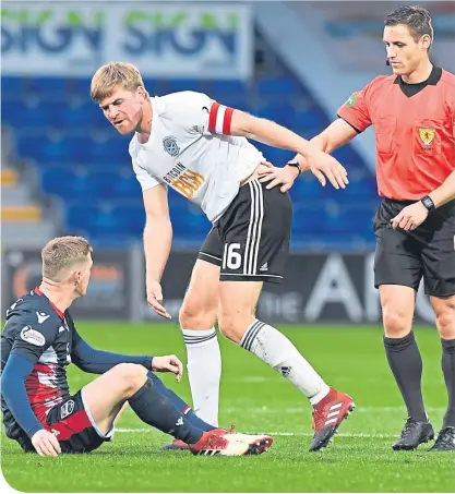  ??  ?? Ref Steven Mclean steps in as County’s Billy Mckay and Ayr centre-half Jamie Adams exchange words