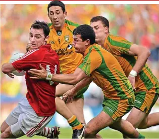  ?? SPORTSFILE ?? Nowhere to hide: Donncha O’Connor (left) and Cork couldn’t match Donegal’s gameplan