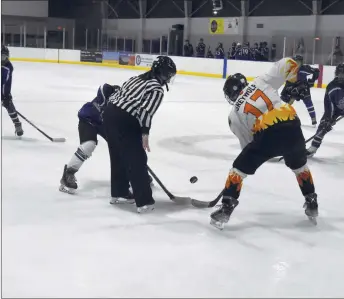  ?? ARCENIO J. TRUJILLO/Taos News ?? Taos’ Hayden Greywolf faces off with a Santa Fe Blue Jacket in the waning moments of the final stanza of the second Taos vs. Santa Fe game at the Genoveva Community Center Ice Rink Feb. 2. Greywolf made two goals for Taos in the 6-5 victory.