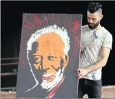  ?? PICTURE: REUTERS ?? Egyptian speed painter Albert Magdy holds the finished painting of American actor Morgan Freeman in Cairo, Egypt, recently.