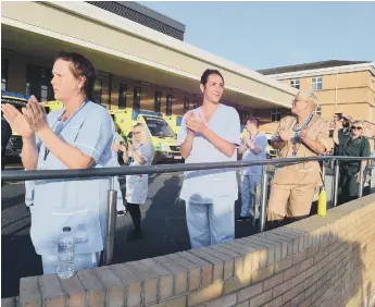  ??  ?? Staff at Sunderland Royal Hospital clapping for carers last year.