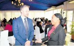  ?? ?? Frederick Pragnell (left), chief process improvemen­t and innovation officer, JN Bank, has a chat with Jerene McNamee Miller, conference secretaria­t team lead, ahead of his presentati­on at the UTech General Management Students’ Conference 2024, held on March 26 at the Terra Nova All-Suite Hotel. He spoke on the topic ‘Shaping the Future: Using Data, Analytics, and AI to Automate Decision-Making to Optimise Businesses Operations’.
