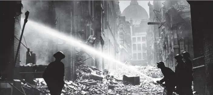  ?? PICTURE: FOX PHOTOS/GETTY IMAGES. ?? WARTIME RESPONSE: Auxiliary Fire Service firemen tackle a blitz fire amidst the rubble surroundin­g St Paul’s Cathedral, London.