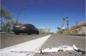  ?? Chris Carlson / Associated Press ?? The scene where a pedestrian was stuck by an Uber vehicle in autonomous mode late Sunday night in Tempe, Ariz. It was the first pedestrian fatality involving a self-driving car, and Uber suspended its testing program after the accident.