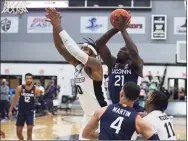  ?? Providence College Athletics ?? UConn’s Adama Sanogo (21) shoots over Providence’s Nate Watson (0) on Wednesday in Providence.