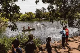  ?? Stephen Lam/The Chronicle ?? Park-goers are seen at Golden Gate Park’s former Stow Lake, named for a 19th century Assembly member who had antisemiti­c and xenophobic views.