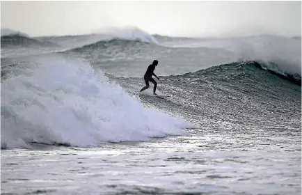  ?? PHOTO: ROBERT CHARLES/STUFF ?? Big waves are expected on New Zealand’s western coastline today. Beachgoers are advised to exercise caution.