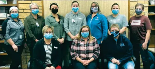  ??  ?? These 10 front-line healthcare workers were the first to receive their COVID-19 vaccine at City County Health District on Monday, December 21. Per requiremen­t they are still wearing masks. Front row (left to right): Andrea Winter, Kerry Due, Sue Lloyd. Back Row: Katie Beyer, Angie Martin, Amanda Nielson, Amber Schmidt, Becky Kratz, Renae Larson, and Betty Tykwinski.