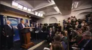  ?? MANUEL BALCE CENETA— THE ASSOCIATED PRESS ?? President Donald Trump with Vice President Mike Pence, left, and members of the president’s coronaviru­s task force speaks during a news conference at the White House on Wednesday, Feb. 26.