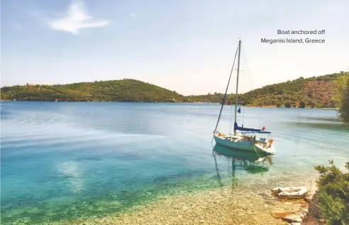  ??  ?? Boat anchored off Meganisi Island, Greece