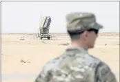  ?? ANDREW CABALLERO-REYNOLDS — POOL ?? A member of the U.S. Air Force stands near a Patriot missile battery at Prince Sultan Air Base in Saudi Arabia.