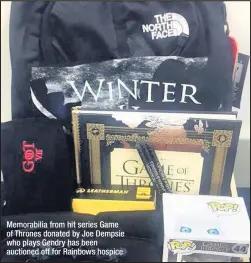  ??  ?? Memorabili­a from hit series Game of Thrones donated by Joe Dempsie who plays Gendry has been auctioned off for Rainbows hospice