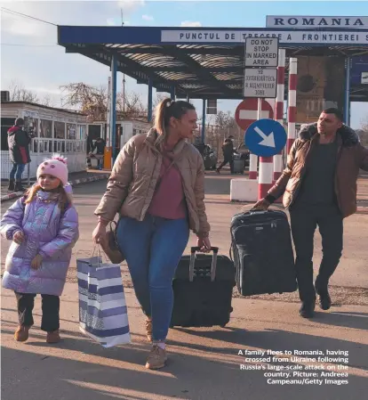  ?? ?? A family flees to Romania, having crossed from Ukraine following Russia’s large-scale attack on the country. Picture: Andreea Campeanu/getty Images