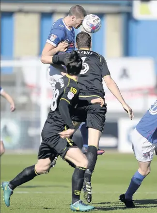  ??  ?? Jamie Proctor heads under pressure from Ben Nugent. Picture: MARK FULLER