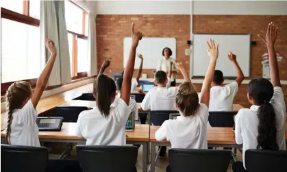  ?? Photograph: Klaus Vedfelt/Getty Images ?? For many teachers today, the end of the school day is the start of a second job.