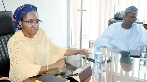  ??  ?? Minister of State for Budget and National Planning, Hajiya Zainab Ahmed (left) with the Senior Special Assistant, Media and Publicity to the President, Malam Garba Shehu, during their visit to Daily Trust Headquarte­rs in Abuja yesterday Photo:
