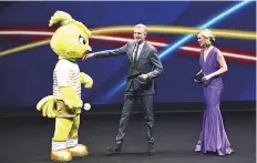  ?? AFP ?? From left: The 2019 Fifa mascot Ettie, French Sports journalist Denis Brogniart and Sports TV host for CNN Internatio­nal Amanda Davies attend the final draw.
