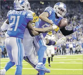  ?? Robert Gauthier Los Angeles Times ?? LIONS CORNERBACK Darius Slay, right, intercepts a pass from the Chargers’ Philip Rivers that was intended for Keenan Allen in the end zone late in the fourth quarter.