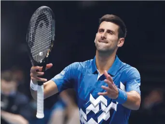  ?? - Associated Press: Frank Augstein ?? Novak Djokovic, vendredi, à Londres.