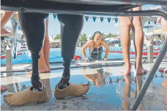  ?? Roger Nomer, The Joplin Globe ?? Haven Shepherd pulls herself out of the pool after warm-ups for a meet in Joplin, Mo., in 2016. She is on a path that could lead to a spot on the U.S. Paralympic team in 2020.