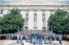  ?? TERRY/ THE OKLAHOMAN] ?? Members of the Oklahoma City Police Department stand outside City Hall during a news conference with the Oklahoma City Fraternal Order of Police Lodge No. 123 on Tuesday. [BRYAN