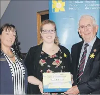 ?? SUBMITTED PHOTO ?? Emma McDermott (centre) received the Leaders of Tomorrow Award from Lt.-Gov. Frank Lewis, while Marlene Mulligan, executive director, Canadian Cancer Society, P.E.I., offers congratula­tions.