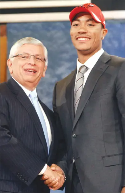  ?? SETH WENIG/ AP ?? Ex- Bulls guard Derrick Rose ( with former NBA commission­er David Stern) was all smiles during the 2008 draft.