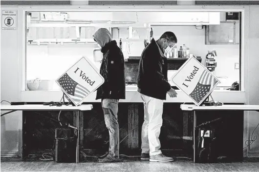  ?? CAMERON POLLACK/THE NEW YORK TIMES ?? Voters cast their ballots Nov. 3 at a church in Sullivan's Island, South Carolina. One possible explanatio­n for 2020's polling misfire involves higher turnout of registered voters.