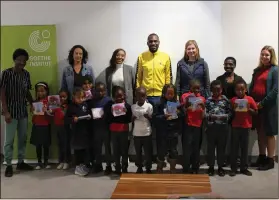  ?? Photo: German Embassy Windhoek ?? Keen readers… Some of the authors and children who attended the book launch.