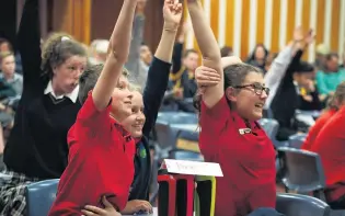  ?? PHOTO: GRETA YEOMAN ?? Nick me! Dorie Qchool pupils (from left) Daniel Dolan (11), Brianna Qloper (12) and Billie Qurridge (13) raise their hands in answer to a question during the quickfire quiz section of the Otago Daily Times Extra! Central Qouth Island years 7 and 8...