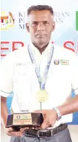  ??  ?? Ganesh A/L Raza, winner of the Dedicated Teacher Award (Male) at the MILORMinis­try of Education-MSSM SPORTS AWARD 2018.