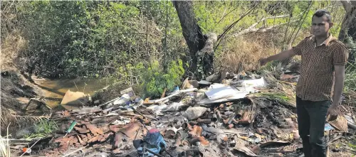  ?? Photo: Waisea Nasokia ?? Jai Ram points to where rubbish piles ended up in the waterways of Nasoso, Nadi on September 14, 2018.