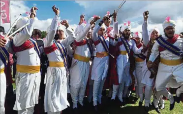  ??  ?? The Sri Dasmesh Pipe Band after a performanc­e in Glasgow in 2015.